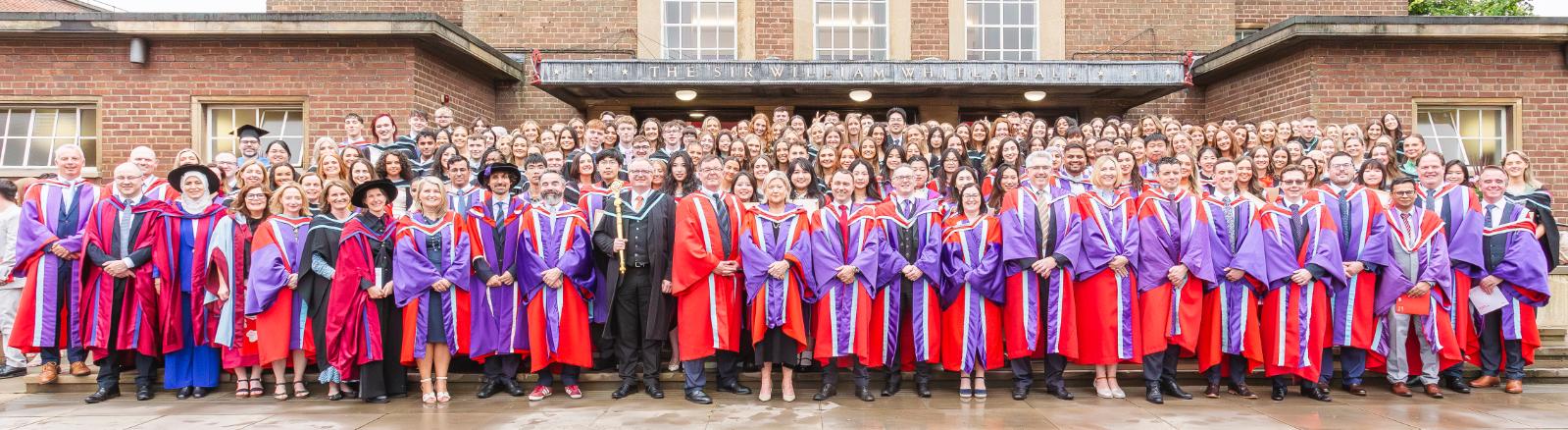 School of Pharmacy graduates following the graduation ceremony
